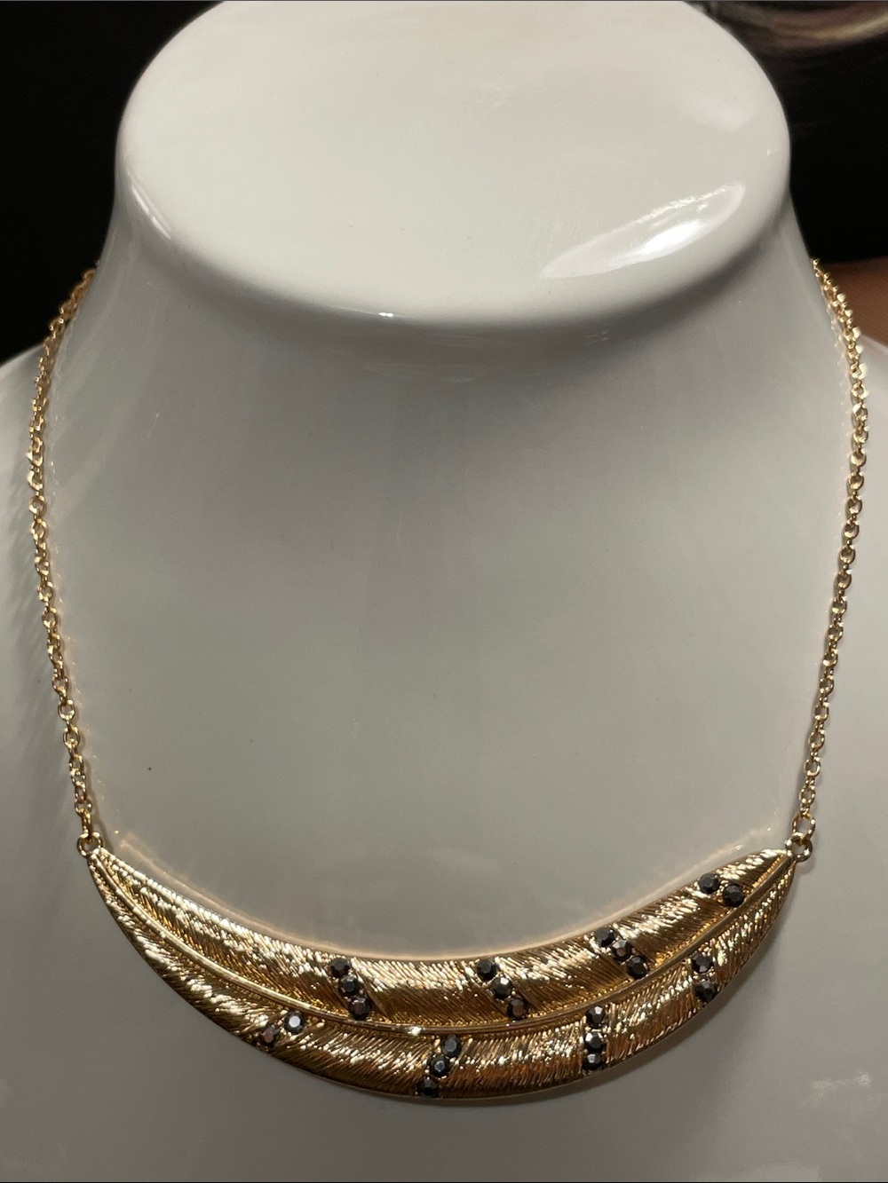 Elegant Gold-Tone Layered Bib Necklace with gray colored rhinestones